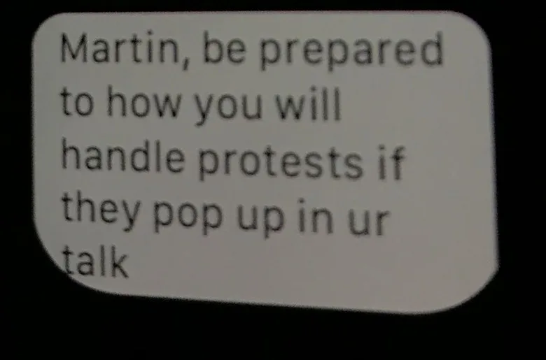 A message on Martin's watch: “Martin, be prepared to how you will handle protests if they pop up in ur talk”.