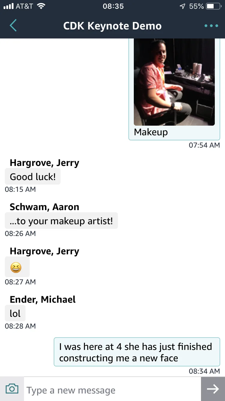 The demo team's group chat on the morning of the keynote. Under a photo of Martin in the make-up chair, colleagues wish him luck, and he replies: “I was here at 4 she has just finished constructing me a new face”.